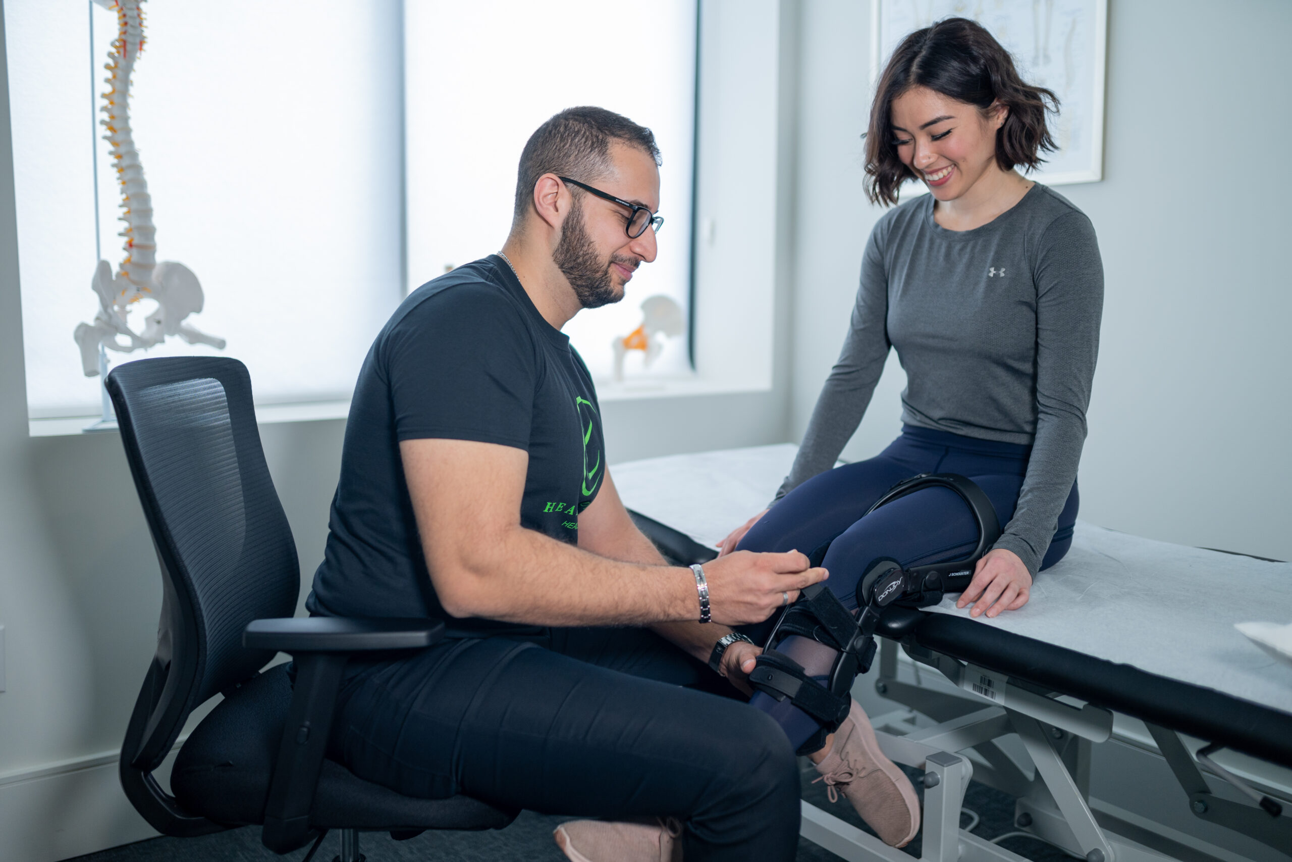 Image of a physiotherapist demonstrating bone growth stimulator