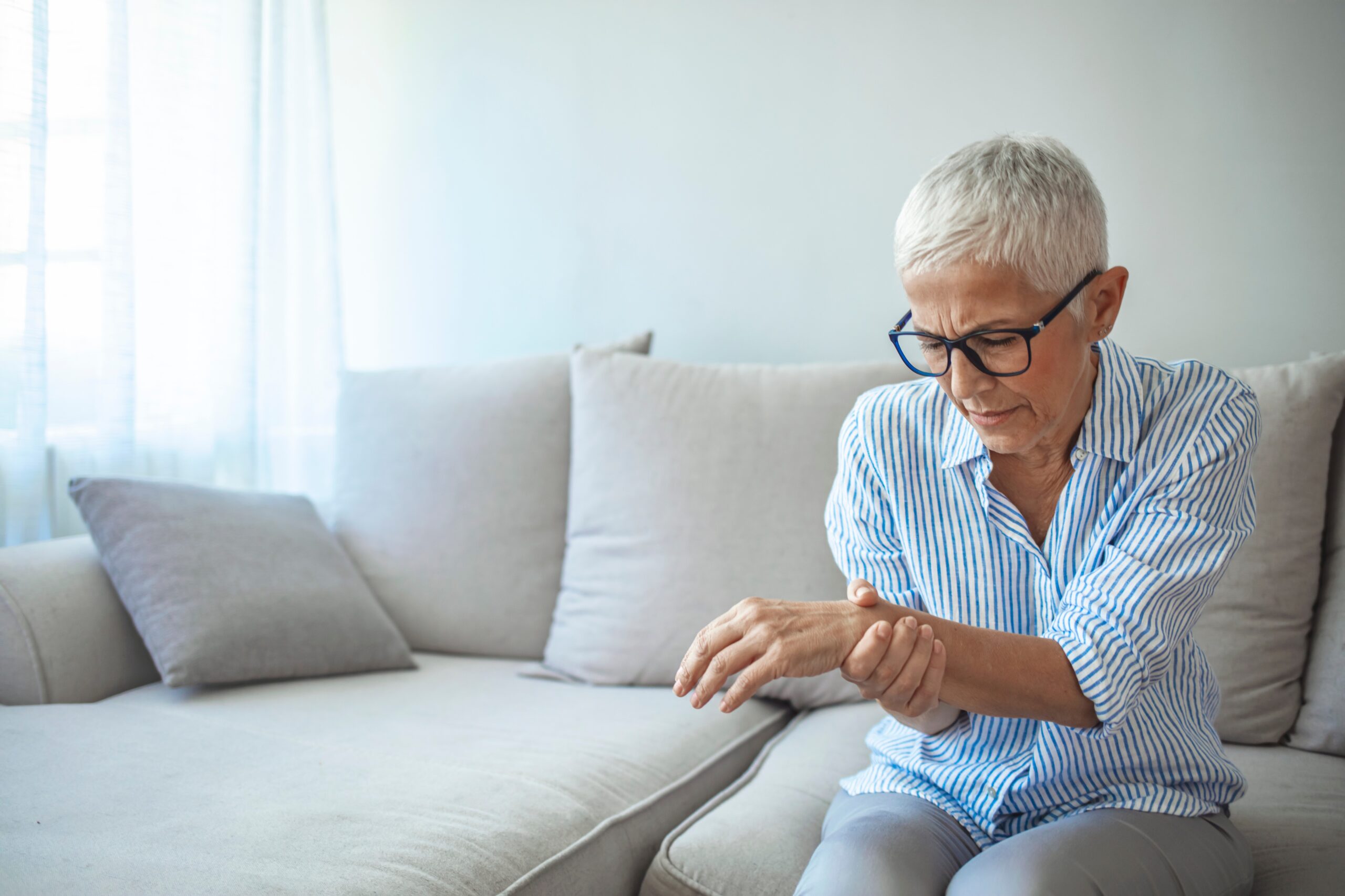 Arthritis Elderly woman female suffering from pain