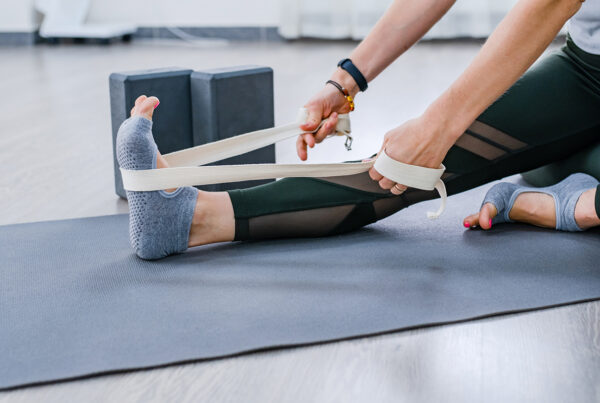 woman stretching leg with yoga img